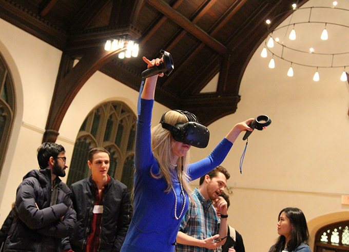 A user tries the Chi virtual reality experience during an event in Andover Chapel. Photo: Michael Naughton, HDS