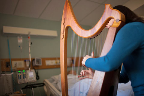 Jennifer Hollis playing the harp
