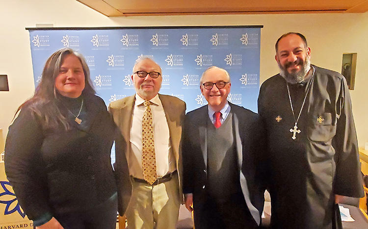 Fr. Pishoy Salama with, from left, K. Healan Gaston, Mark Silk, and E. J. Dionne on November 18, 2019