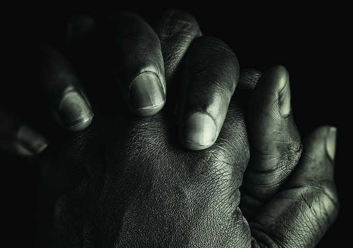 Folded hands in prayer shape