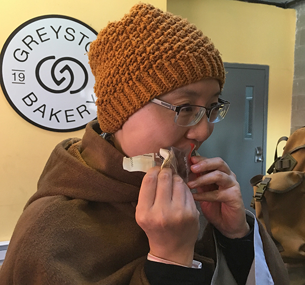 Ven. Xianfeng Xu munching on a Greyston Bakery brownie.