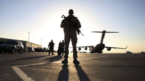 A soldier stands guard at Kandahar Air Base in Afghanistan on December 8, 2013. REUTERS/Mark Wilson/Pool.  THOUGH NONVIOLEN