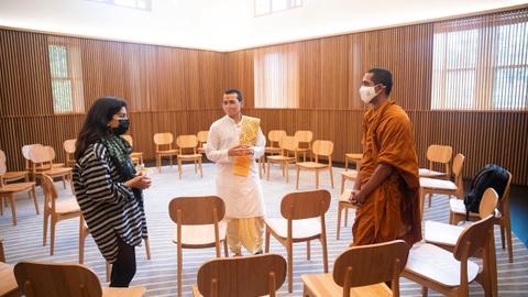 In Harvard Divinity School’s new Swartz Hall, student Minahil Mead (from left), Hindu monk Vandan Ranpurwala, and student and Buddhist monk Mahayaye Vineetha meet in the multifaith space. Photo by Kris Snibbe/Harvard Staff Photographer